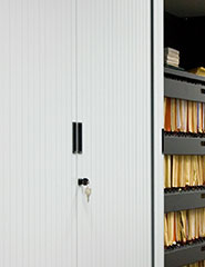 Tambour door locks